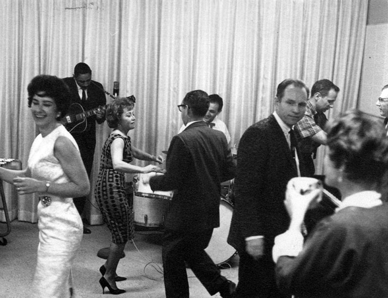 Frank Braxton playing guitar at a Format Films holiday party, ca. early-1960s. (Photo: Ruben Apodaca Collection.)